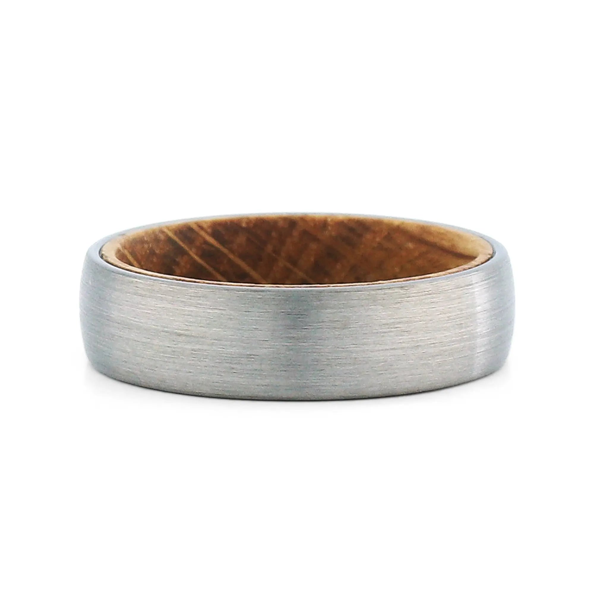 Top view of a men's brushed tungsten wedding band with a real whiskey barrel wood inlay.