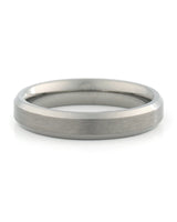 A brushed metal band ring with a polished beveled edge, shown on a clean white background.