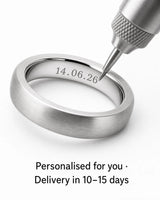 Wedding ring being personalised with engraving and a 10–15 day delivery estimate
