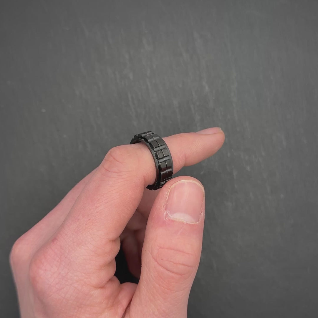 stylish black anxiety ring with smooth spinning gears