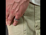 Man wearing a Brushed silver men’s wedding band with polished edges