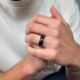 black brushed tungsten ring with a rose gold polished sleeve