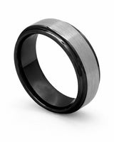 Silver and black Ridge tungsten wedding ring shown at an angle