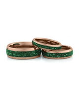 Rose gold emerald tungsten couples wedding ring set shown together