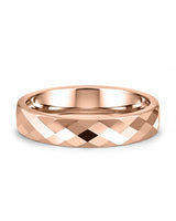 Rose gold faceted tungsten wedding ring lying flat, showing the diamond-cut finish