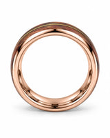 Side profile of rose gold guitar string wedding band showing the wood inlay and polished edges
