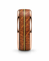 Front view of rose gold tungsten wedding ring with whiskey barrel wood and guitar string