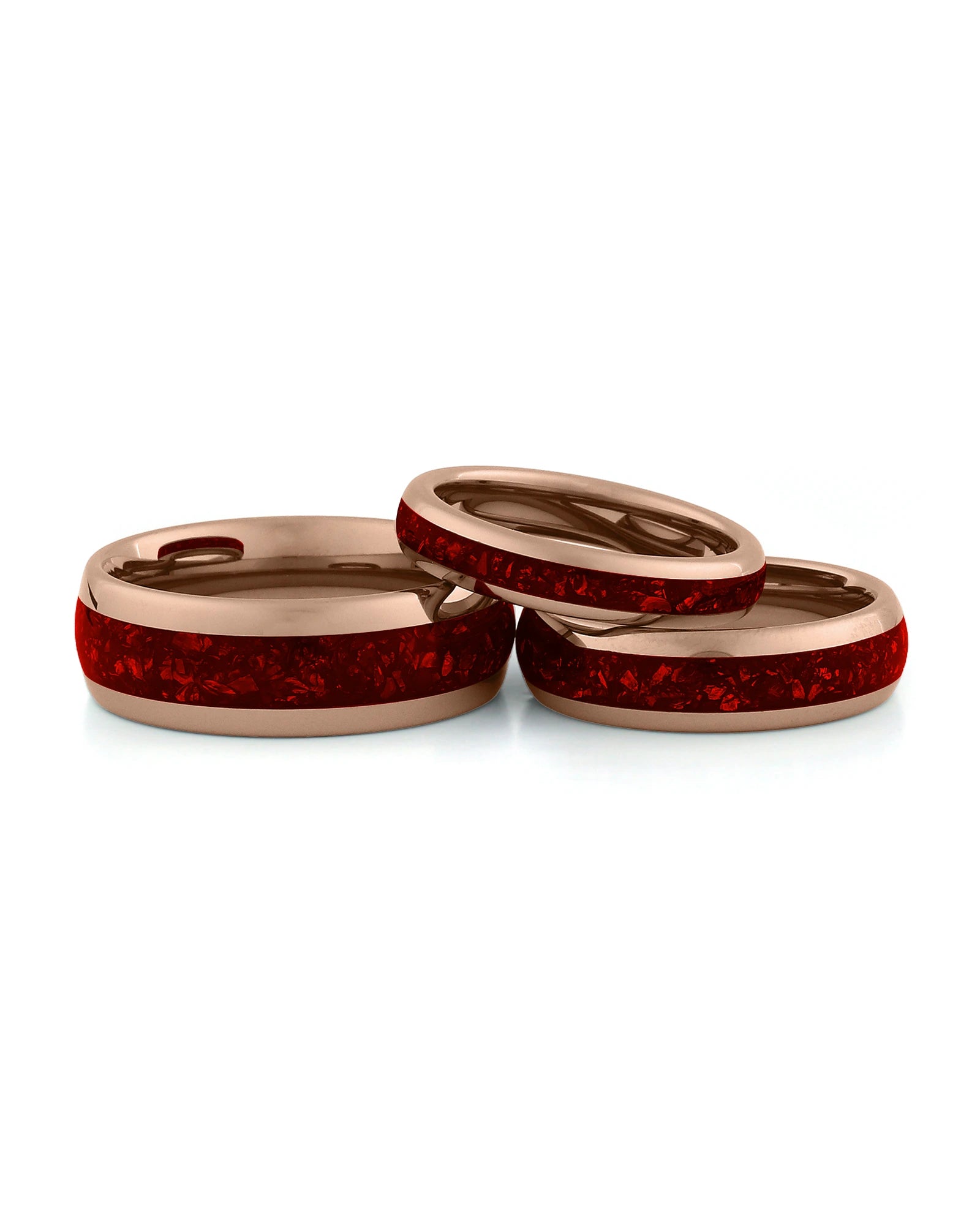 Rose gold ruby tungsten couples wedding ring set shown together