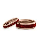 Matching rose gold wedding bands with red ruby stone inlays