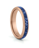 Rose gold 4mm tungsten ring with blue sapphire inlay shown at an angle