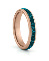 Rose gold 4mm tungsten ring with turquoise stone inlay shown at an angle