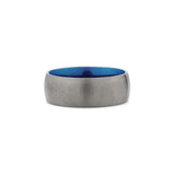 close up of an 8mm wide silver and blue titanium ring