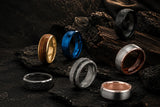 Collection of various rings on a dark stone surface