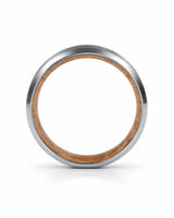 Side profile of a silver beveled tungsten wedding ring with a whiskey barrel wood inner sleeve showing the band thickness.