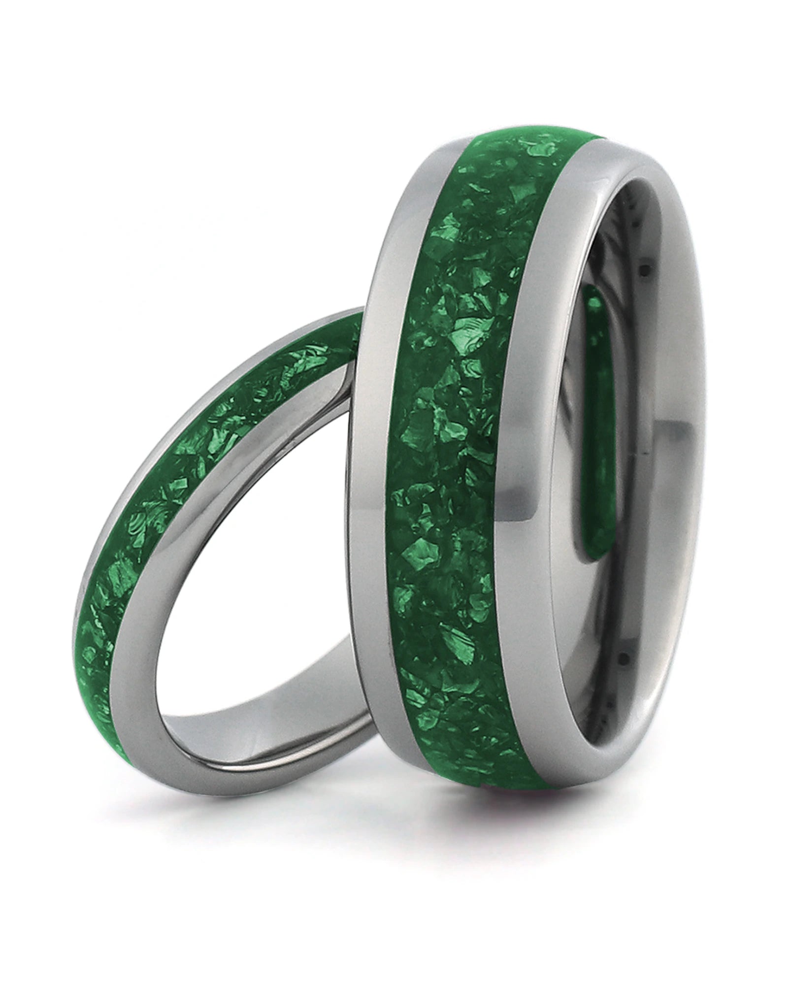 Matching silver tungsten wedding rings with emerald inlays, including an 8mm band