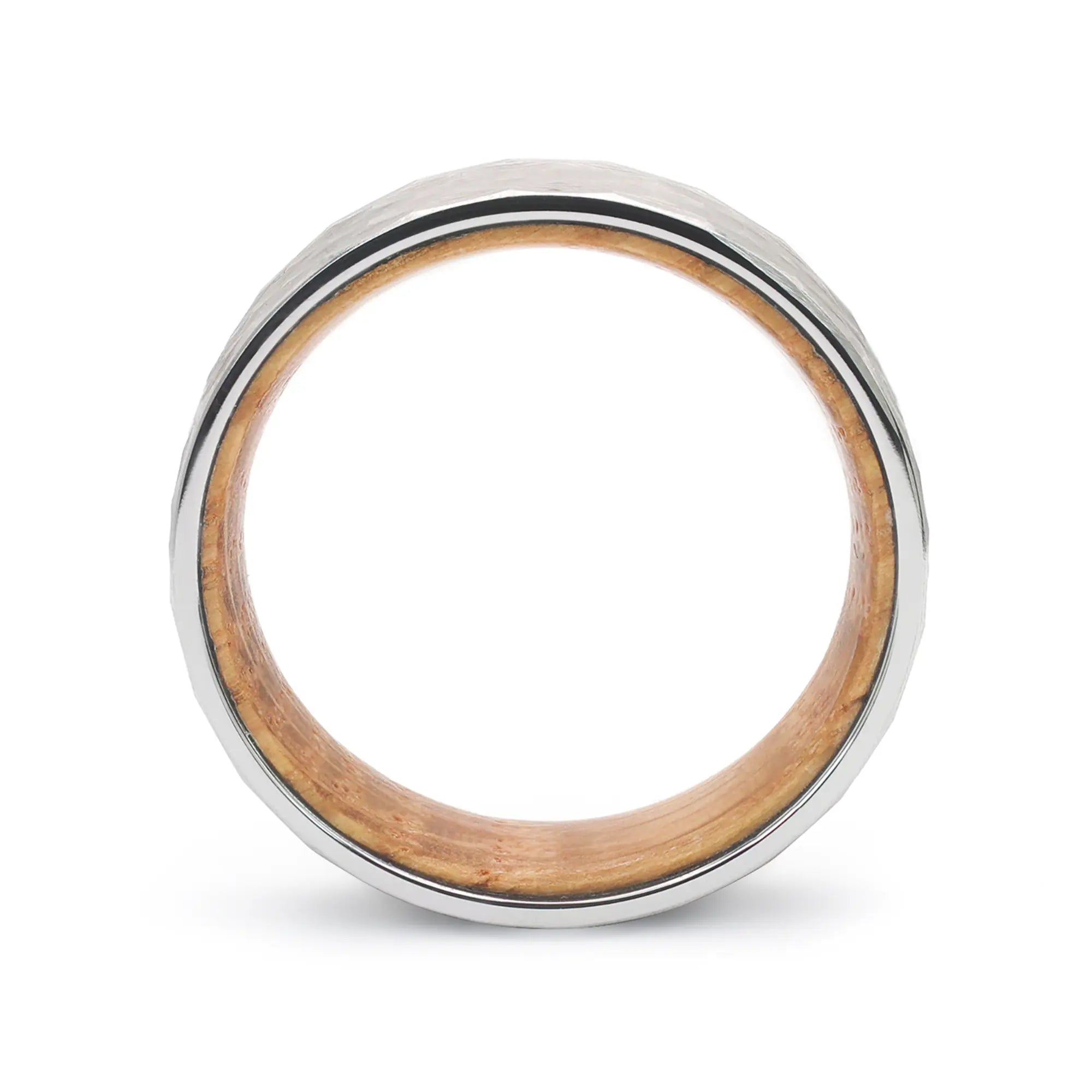 Side profile of a silver hammered tungsten whiskey barrel wedding ring with reclaimed oak wood.