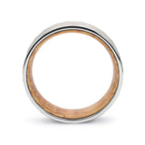 Side profile of a silver hammered tungsten whiskey barrel wedding ring with reclaimed oak wood.