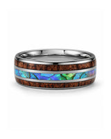 Koa wood and abalone shell tungsten ring lying flat showing the inlay detail