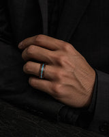 lifestyle photo of a man wearing a koa wood and abalone shell tungsten ring