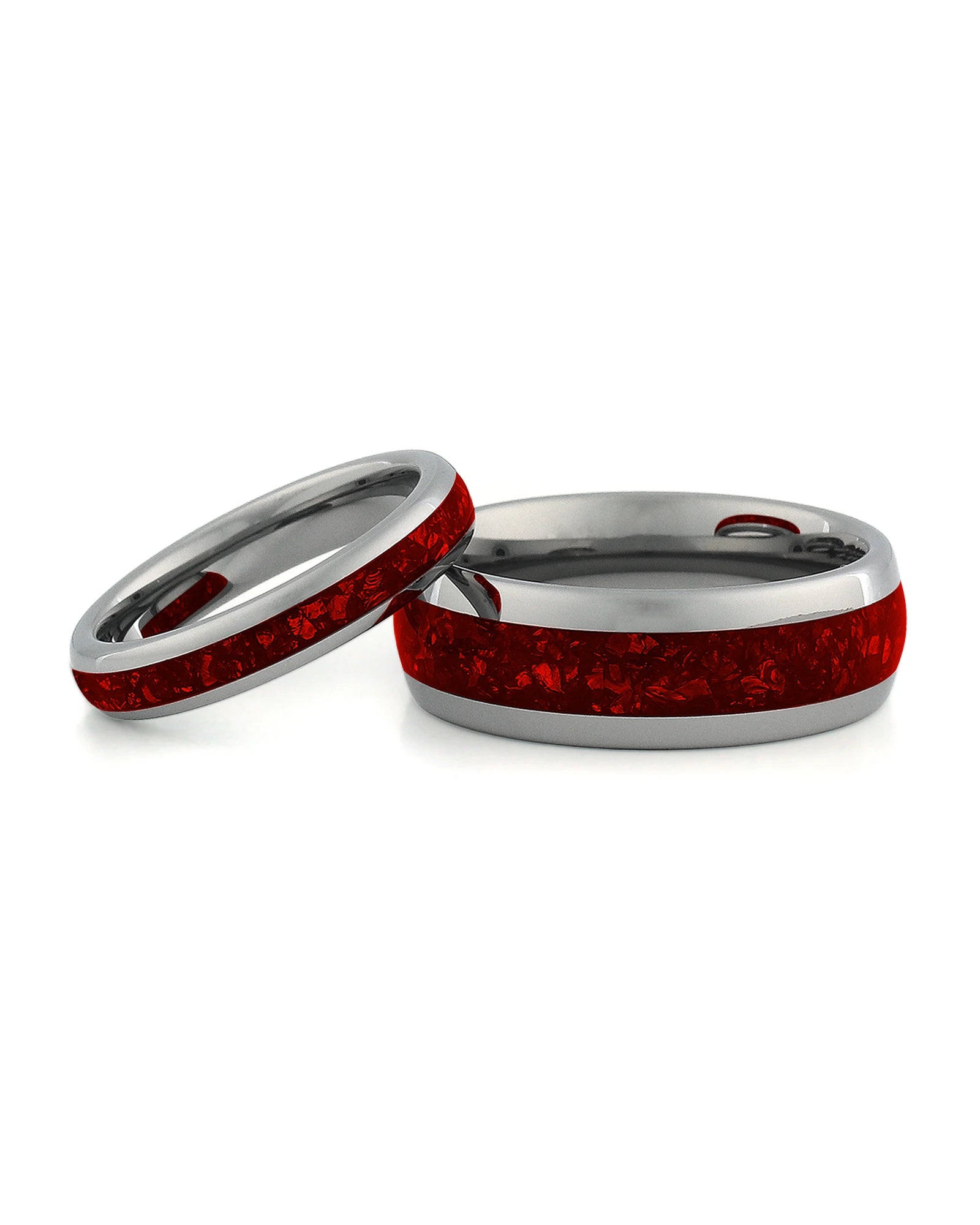 Matching silver wedding bands with red ruby stone inlays