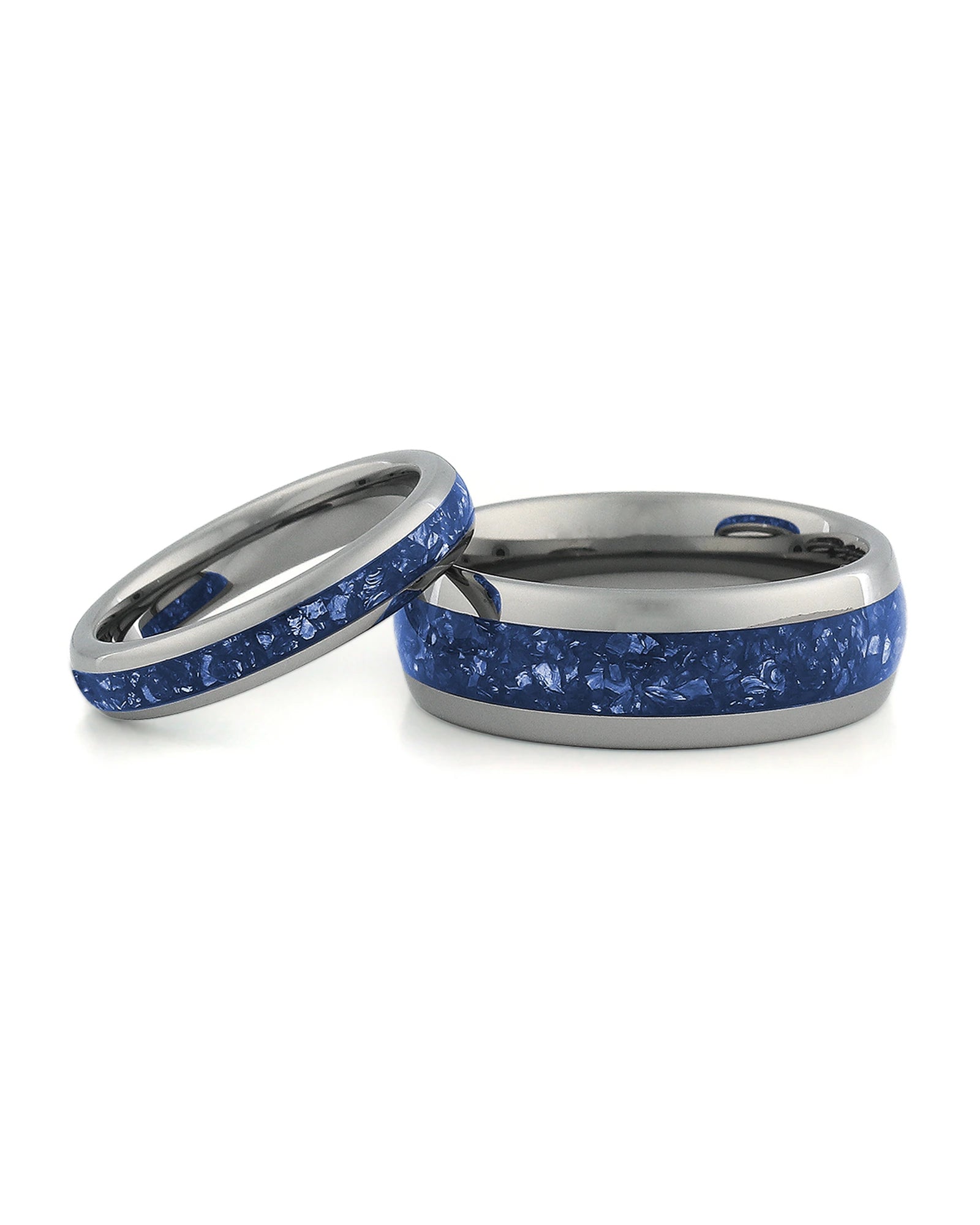 Matching silver wedding bands with blue sapphire stone inlays