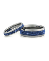 Matching silver wedding bands with blue sapphire stone inlays
