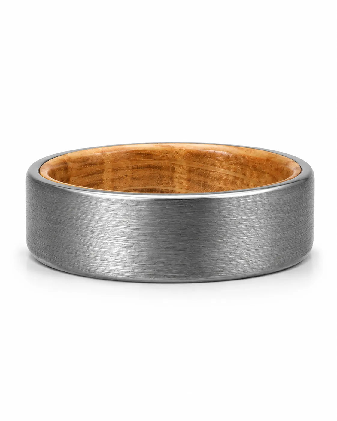 Silver tungsten wedding ring with brushed finish and whiskey wood interior photographed lying flat on a white studio background.