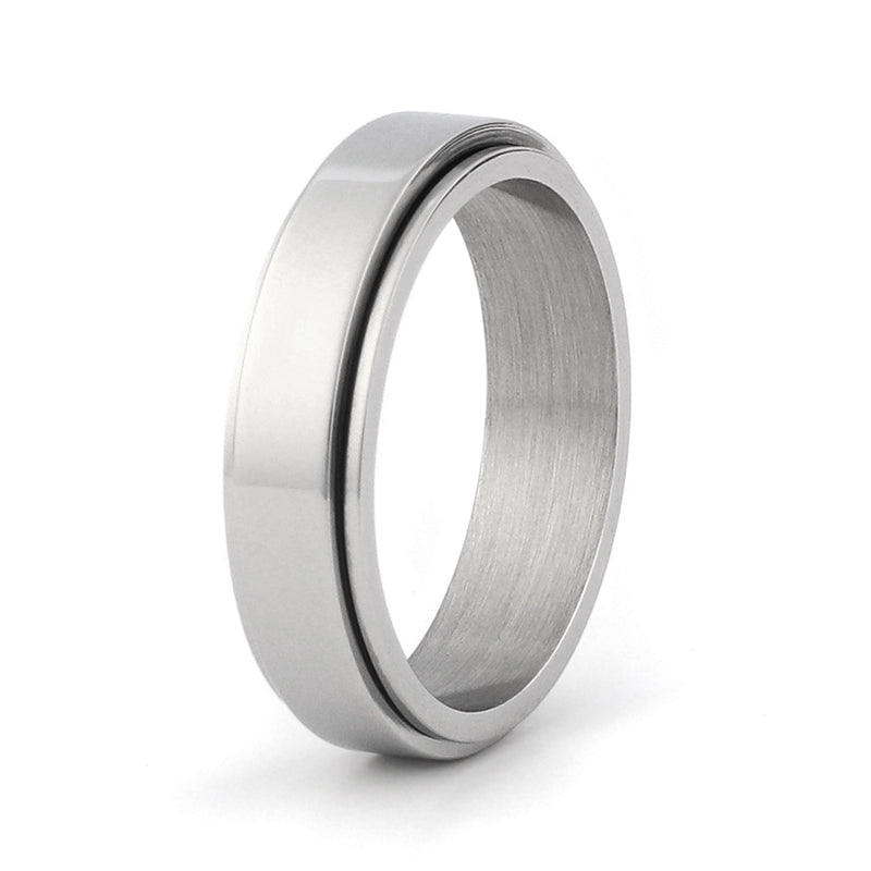 Silver spinner wedding ring with rotating centre detail on a soft neutral background with modern styling.