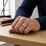 gold cuban chain spinner ring 8mm rune engraving on male model