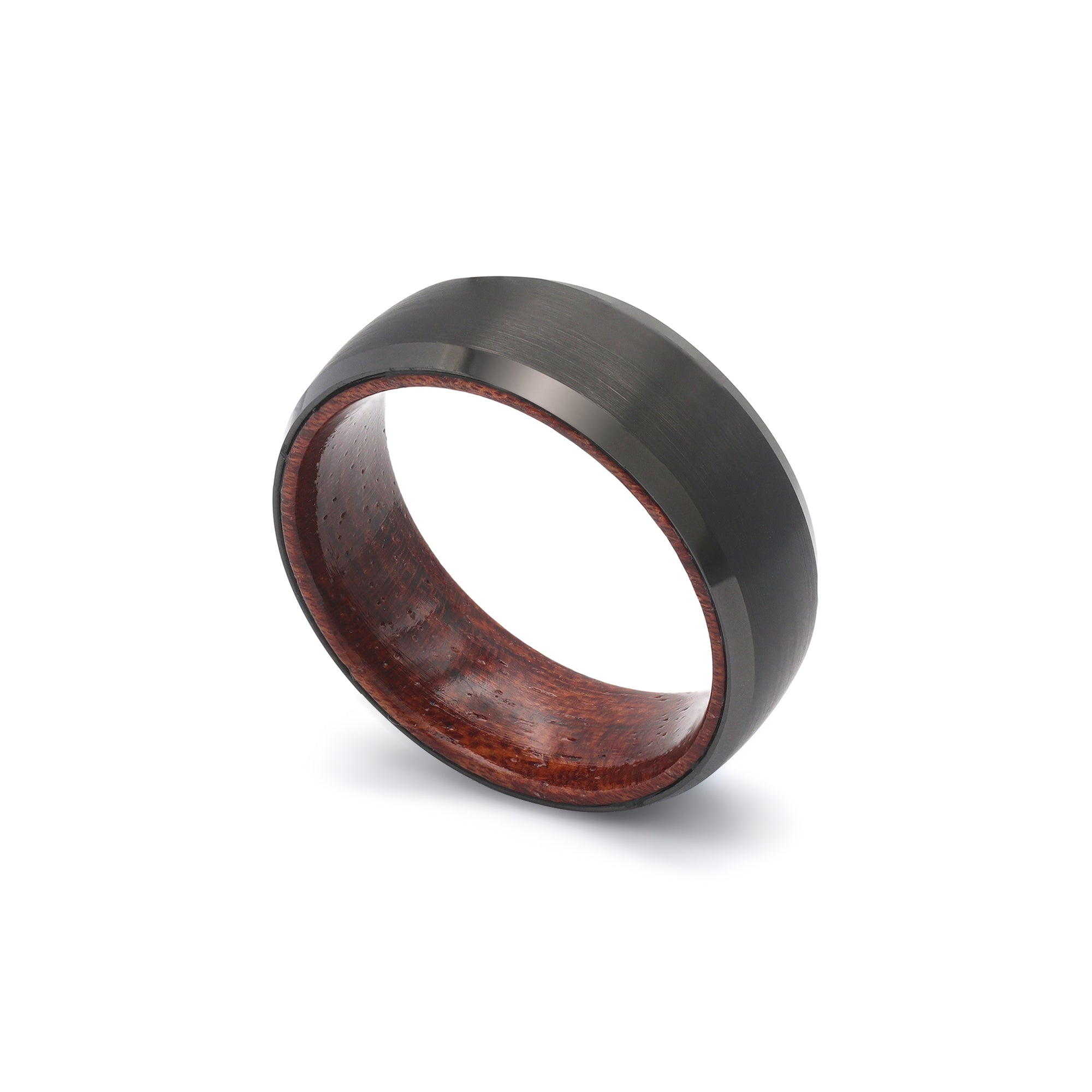 mens black tungsten wedding ring with beveled sides and a recycled maple wood sleeve leaning view