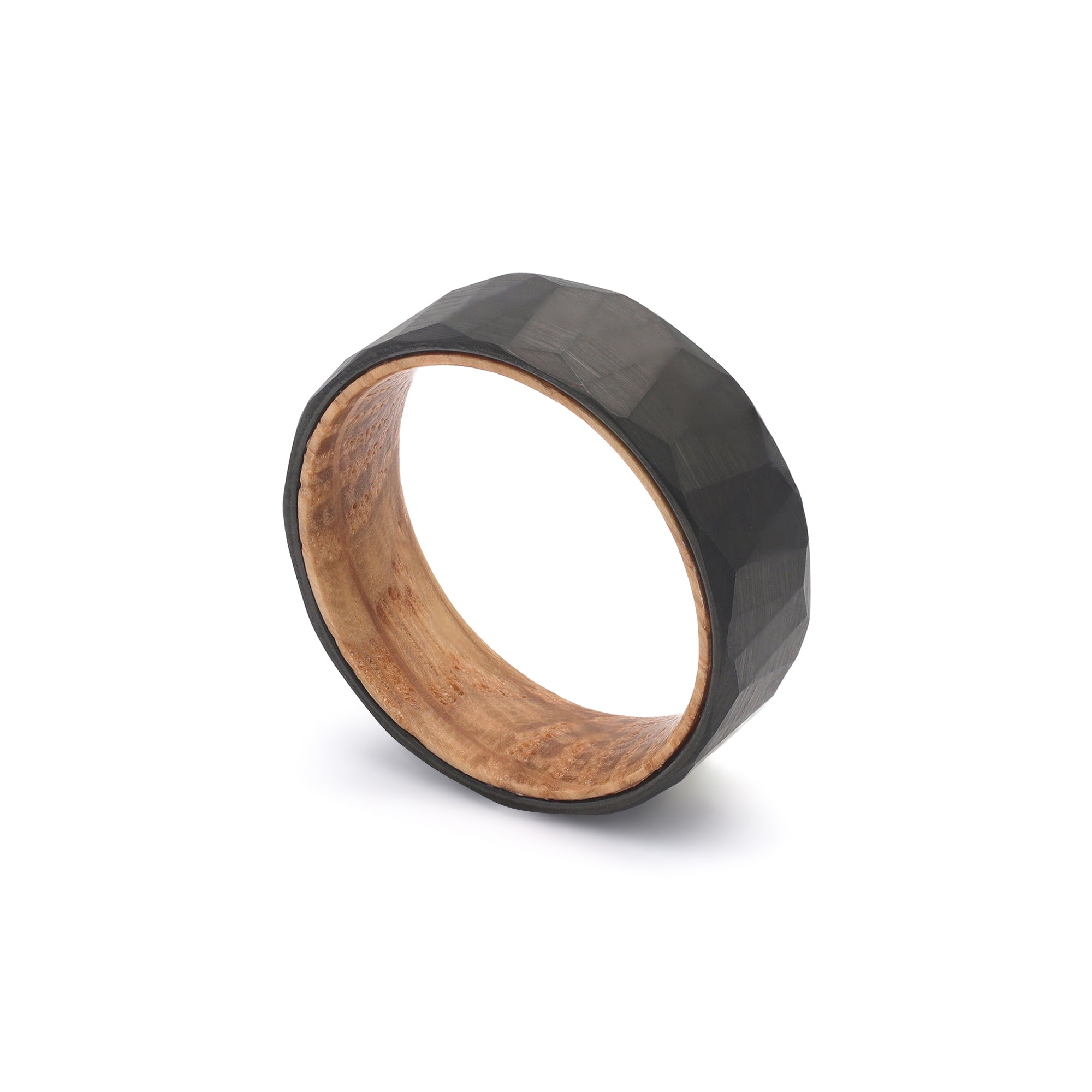 geometric pattern mens wedding ring with oak wood sleeve falling view