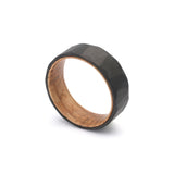 geometric pattern mens wedding ring with oak wood sleeve falling view