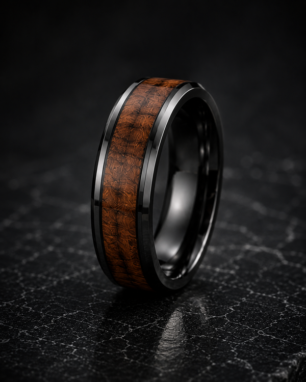tungsten ring with whiskey barrel wood inlay on dark surface