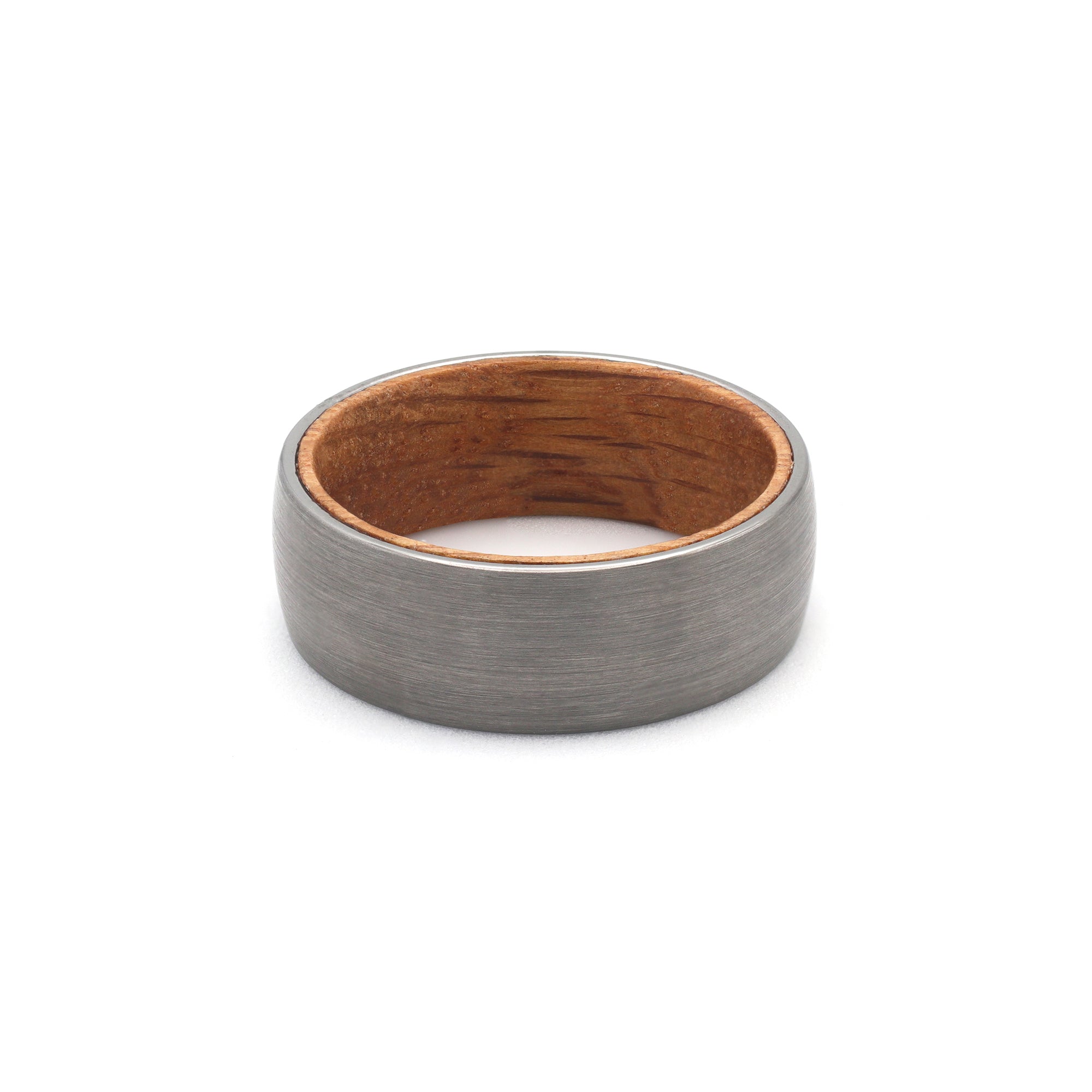 flat view of a mens brushed silver tungsten wedding ring with whiskey barrel wood sleeve